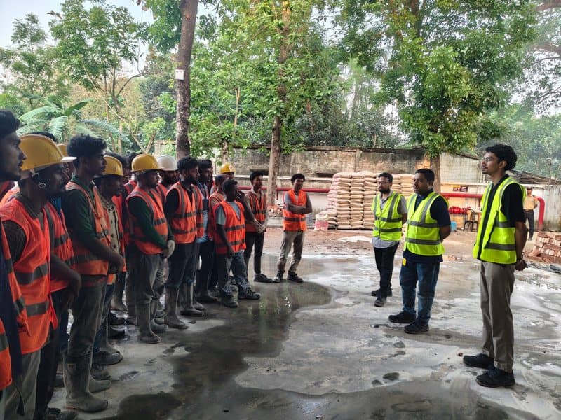 Site crew in orange and yellow vests